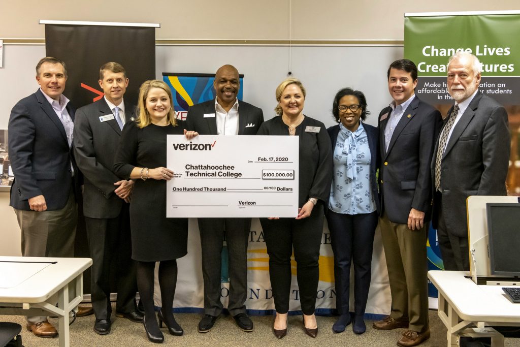 Officials who gathered for the Verizon Foundation $100,000 grant presentation included, shown here from left to right, Chattahoochee Tech Foundation Vice Chair Mark Goddard, TCSG Commissioner Greg Dozier, State Rep. Matthew Gambill, Verizon Director of Government Affairs Julie Smith, City of Acworth Alderman Tim Houston, Georgia Public Service Commissioner Tricia Pridemore, Michelle Arrington, of Verizon, State Rep. Matthew Gambill, and Chattahoochee Tech President Dr. Ron Newcomb.