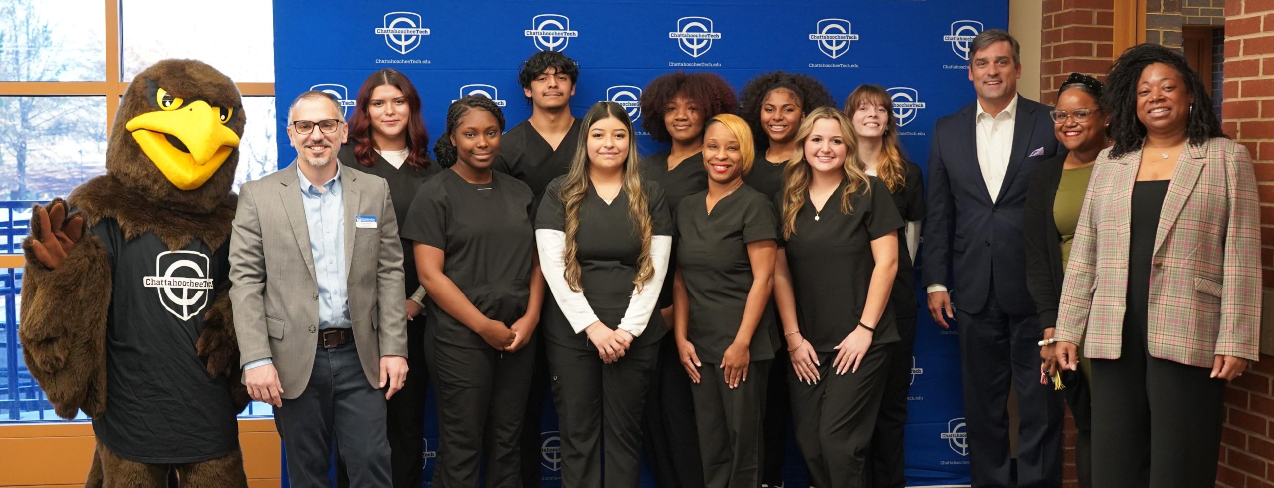 Chatt Tech Dual Enrollment Students in CNA program with college and MHS officials and college mascot