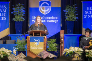 Heather Pence Speaks from Podium at Fall 2024 Commencement