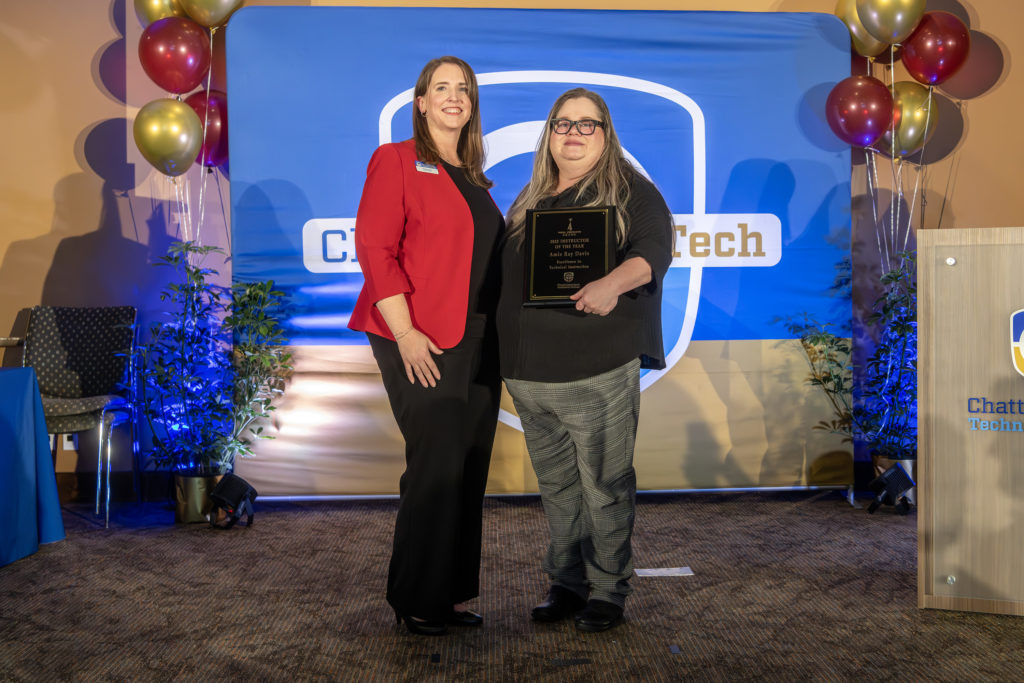 2025 Rick Perkins Award winner Amie Ray Davis and Heather Pence on stage